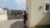 Torkwase Kuraun stands at the spot were her brother, journalist Tordue Salem, was standing the morning of Oct. 13, 2021, the she last time she saw him, Nov. 04, 2021. (T. Obiezu/VOA)