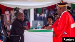 Burundi's President elect Evariste Ndayishimiye attends his inauguration ceremony following the sudden death of his predecessor Pierre Nkurunziza, at the Ingoma stadium in Gitega, Burundi, June 18, 2020. 