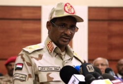 FILE - Sudanese deputy chief of the ruling miliary council Mohamed Hamdan Dagalo delivers a speech after inking an agreement with protest leaders in Khartoum, July 17, 2019.