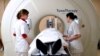 FILE - Patient preparing to undergo a tomotherapy rays treatment, at the Oscar Lambret Center in Lille, northern France.