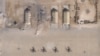What appears to be damage from Iranian missiles at Al Asad air base in Iraq is seen in a satellite picture taken Jan. 8, 2020. The base houses U.S. military personnel.