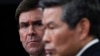 Defense Secretary Mark Esper, left, listens as South Korean National Defense Minister Jeong Kyeong-doo, right, speaks during a news conference at Pentagon in Washington, Feb. 24, 2020.