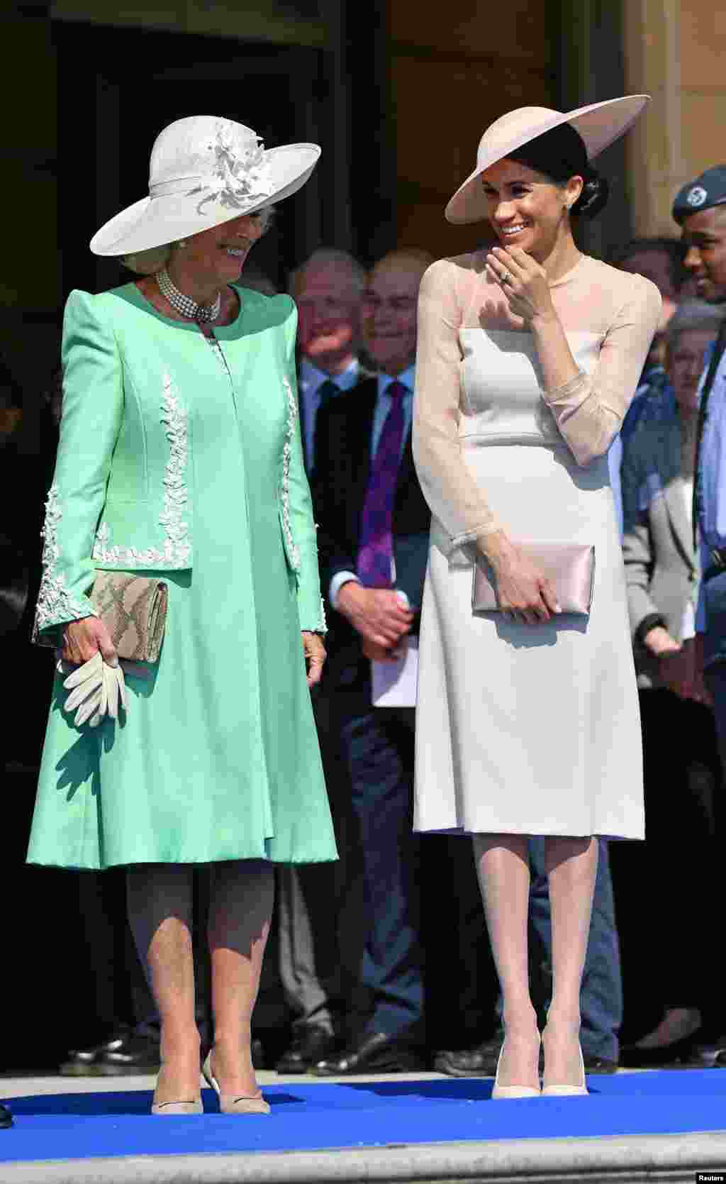Meghan, Duchess of Sussex, attends a garden party at Buckingham Palace, with Camilla the Duchess of Cornwall, in London.