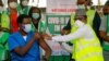 FILE - Dr. Ngong Cyprian gets a dose of COVID-19 vaccine at the National hospital in Abuja, Nigeria, March 5, 2021.