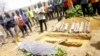 People attend the burial of Monday Doma, the student killed after gunmen stormed the Government Science Secondary School Kagara and kidnapped dozens, in Niger state, Nigeria, Feb. 17, 2021.