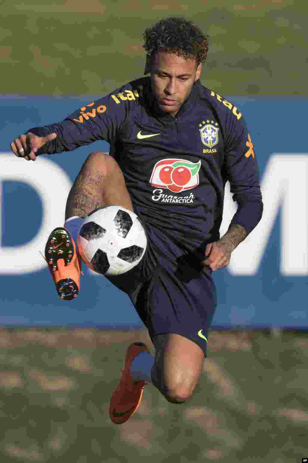 Brazil's Neymar controls the ball during a practice session at the Granja Comary training center, in Teresopolis, Brazil.