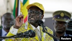 Zimbabwe's President Robert Mugabe addresses supporters at the elective congress in Harare, Zimbabwe, Dec. 4, 2014.