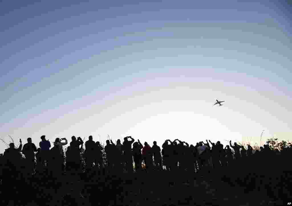 Hundreds of people watch and photograph the Airbus of the French airline Air France taking off from Tegel (TXL) airport in Berlin, Germany. Tegel Airport closes with the departure of the last scheduled flight number AF 1235 to Paris.