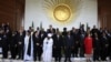 Country leaders get ready to pose for a group photograph during the 50th anniversary of the establishment of the Organization of African Union (OAU), during the 21st Ordinary Session of the Assembly of Heads of States and Government in Addis Ababa, Ethiop