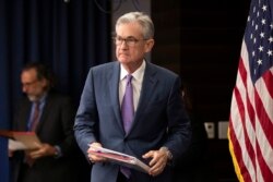 FILE - Federal Reserve Chairman Jerome Powell walks to the podium during a news conference in Washington, July 31, 2019.