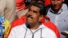 El presidente venezolano Nicolás Maduro gesticula durante su participación en una marcha por el Día del Trabajador en Caracas, el 1 de mayo de 2024. Su gobierno habría contratado a una firma financiera experta en reestructuración de deudas.