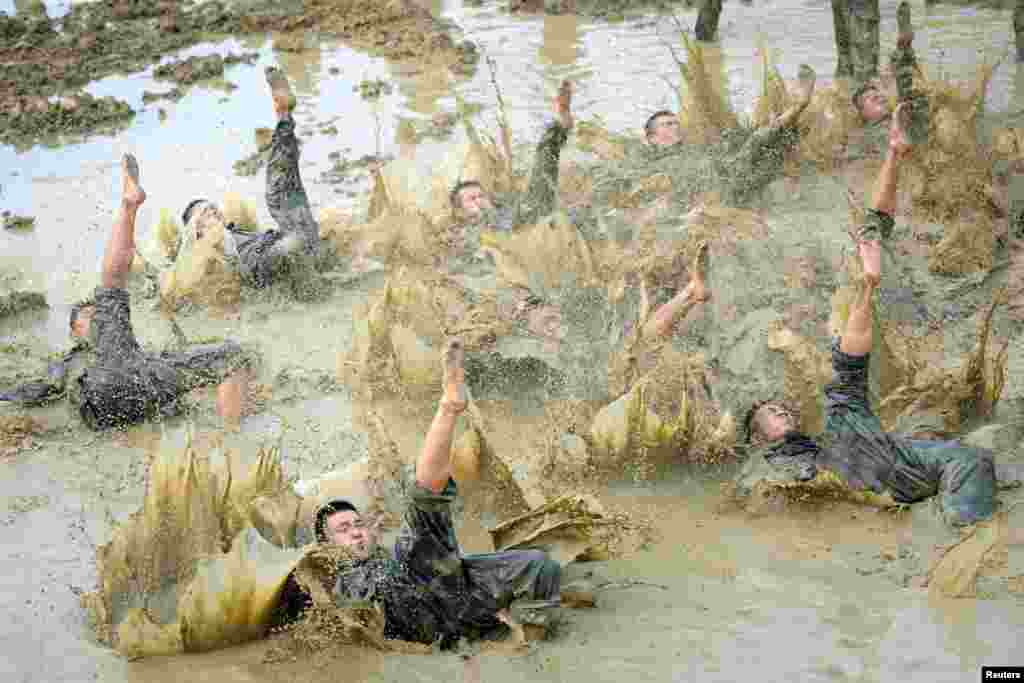 Paramilitary policemen take part in a drill in Baise, Guangxi Zhuang Autonomous Region, China.