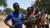 A picture taken on March 6, 2014 shows members of the Chritisian militant group Revolution of Justice (RJ) arriving in the village Nanga Boguila between Bossangoa and Bozoum. 