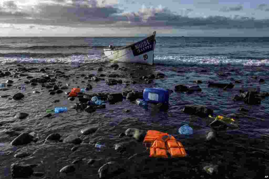 A wooden boat used by migrants from Morocco is seen at the coast of the Canary Islands.