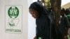 FILE - A woman casts her ballot during Nigeria's presidential election at a polling station in Kazaure, Jigawa state, Nigeria, Feb. 23, 2019. Nigerian election officials say they have recorded at least 42 attacks on its facilities since the 2019 polls. 