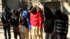 FILE - Pakistani suspects allegedly associated with the Islamic State group, wait to appear in an anti-terrorism court in Gujranwala, Pakistan, Dec. 29, 2015.