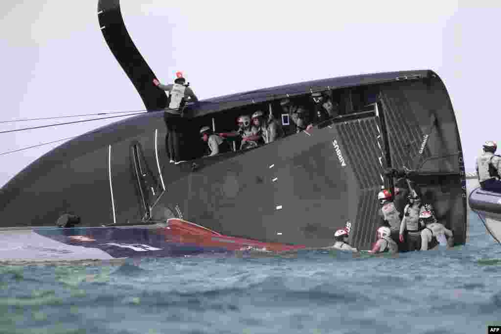 New York Yacht Club American Magic is capsized during Round Robin two, Race three against Luna Rossa Prada Pirelli of the Prada Cup 2021, the challengers series of the 36th America's Cup in Auckland, New Zealand.