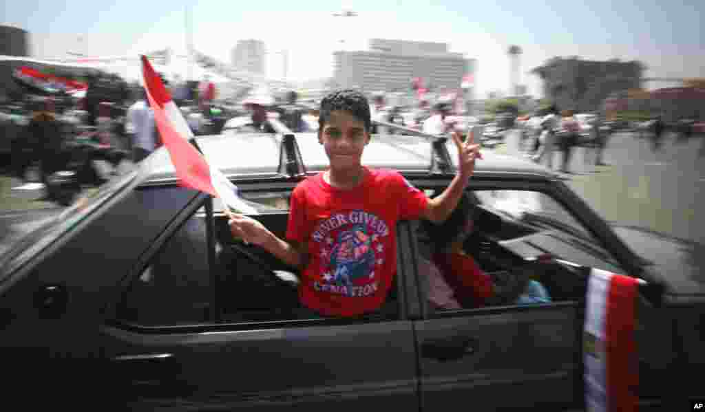 A Morsi supporter celebrates his victory in Tahrir Square.