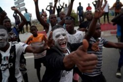 Supporters celebrate the arrival of the former Ivorian President Laurent Gbagbo in Abidjan, Ivory Coast, June 17, 2021.