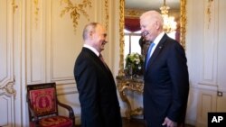 Russian president Vladimir Putin, left, talks with US president Joe Biden, right, during the U.S. - Russia summit in Geneva, Switzerland, June 16, 2021.