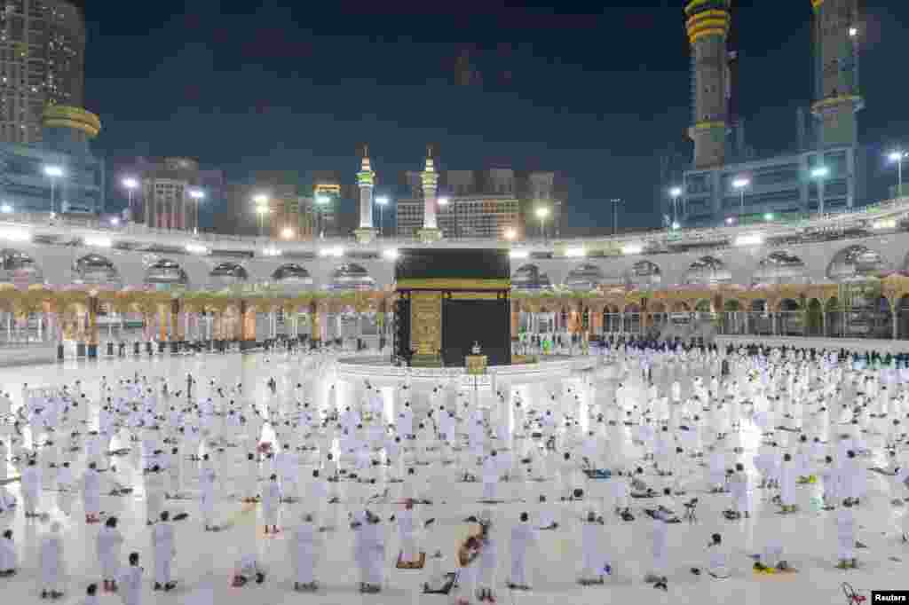 Muslims, keeping a safe social distance, perform Umrah at the Grand Mosque after Saudi authorities ease the COVID-19 restrictions, in the holy city of Mecca, Saudi Arabia. (Saudi Press Agency/Handout)