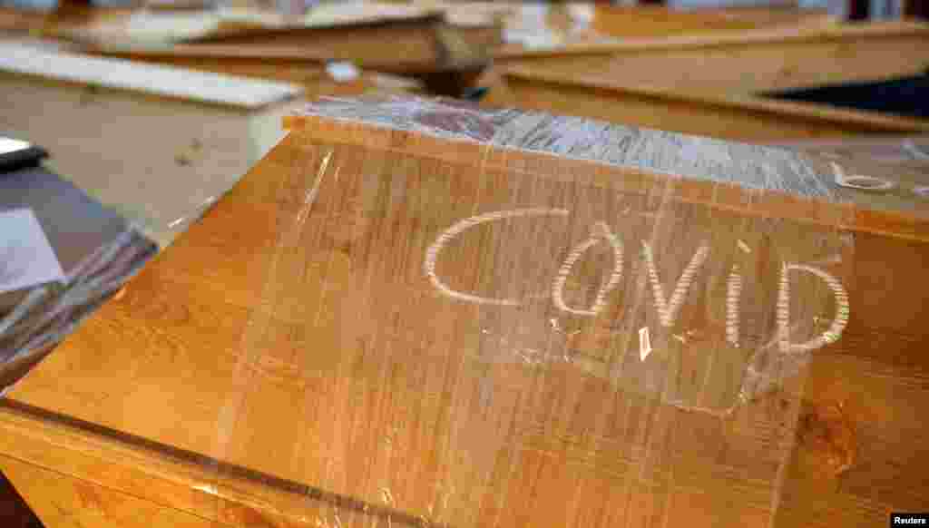 Coffins of people who passed away due to the coronavirus are seen in the Meissen crematorium, amid the COVID-19 pandemic in Meissen, Germany.