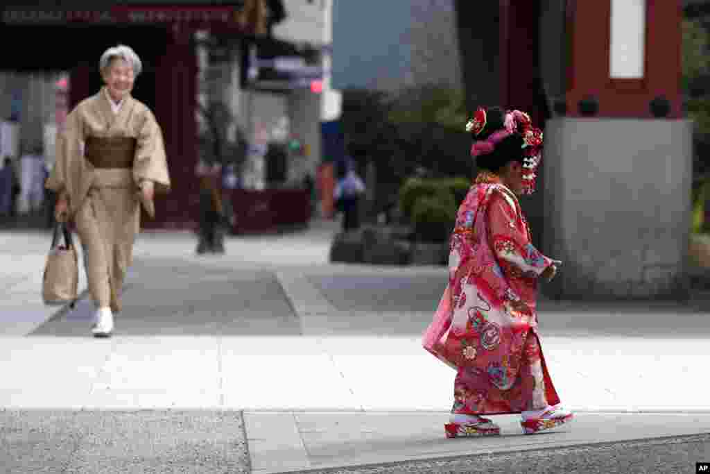 A child in colorful kimono walks at Tokyo's Asakusa district, Japan, on the occasion of Shichigosan celebration.