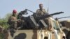 FILE - A convoy of Cameroon's army soldiers as part of a reinforcement of its military forces against Nigerian Islamist group Boko Haram.