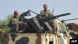 FILE - A convoy of Cameroon's army soldiers as part of a reinforcement of its military forces against Nigerian Islamist group Boko Haram.