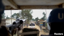 Pasukan PBB yang di Republik demokratik Kongo (MONUSCO) berpatroli menuju area kamp Kigonze, Kongo, pada 2 Maret 2023. (Foto: Reuters/Paul Lorgerie)