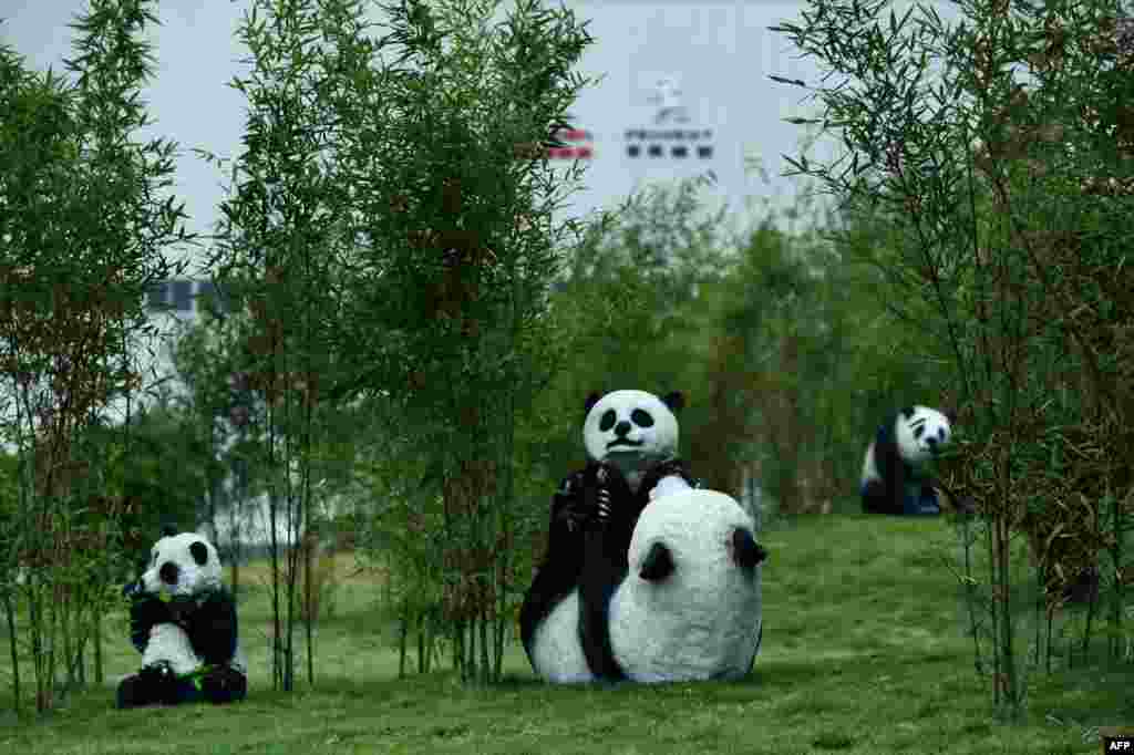 Panda sculptures stand on the grounds at the DPCA Chengdu plant in Chengdu, China.
