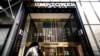 FILE - Pedestrians pass security barricades in front of Trump Tower, Feb. 17, 2021, in New York. Former President Donald Trump owns a penthouse condominium in the skyscraper and the Trump Organization has its headquarters there.