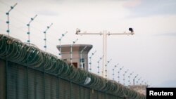 Security cameras are installed above the perimeter fence of what is officially known as a vocational skills education center in Dabancheng, in Xinjiang Uighur Autonomous Region, China, Sept. 4, 2018. 