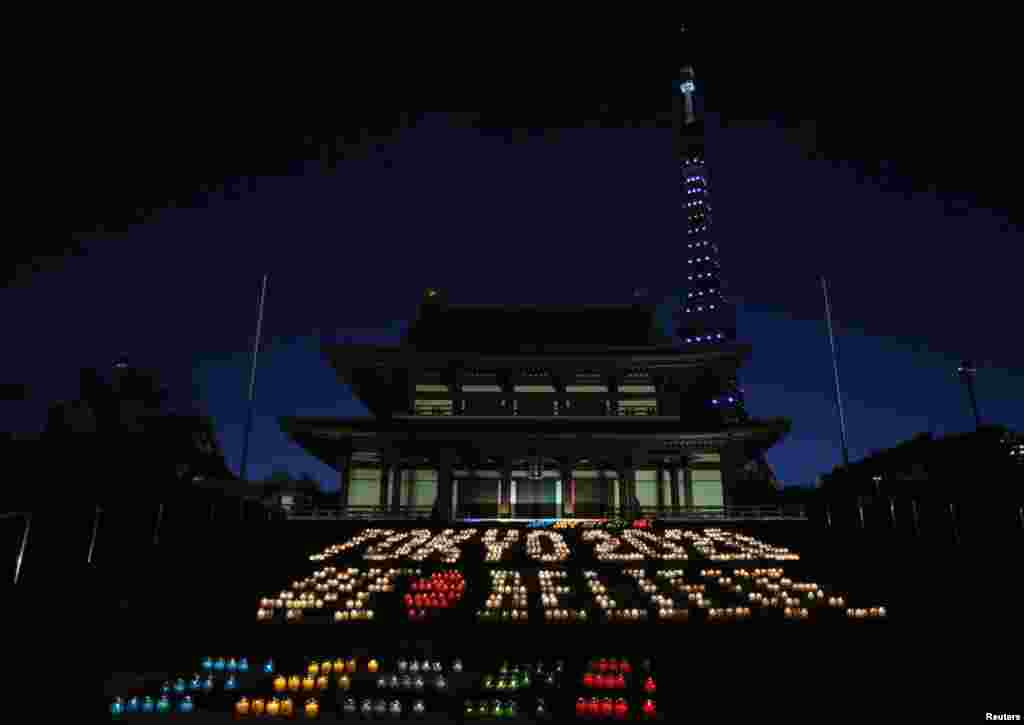 A message reading "Tokyo 2020 We Believe", made up of 2,020 candles, is displayed at Zojoji temple in Tokyo, Japan. Organizers of the event hope the International Olympic Committee (IOC) will choose Tokyo at the IOC meeting in Buenos Aires in Argentina Sept. 7, as the host city for the 2020 Olympic and Paralympic Games .