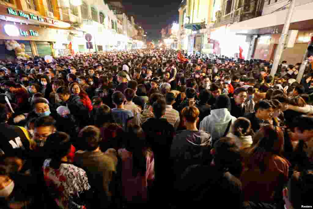 People gather on a street during New Year's Eve celebrations in Hanoi, Vietnam Jan. 1, 2021.