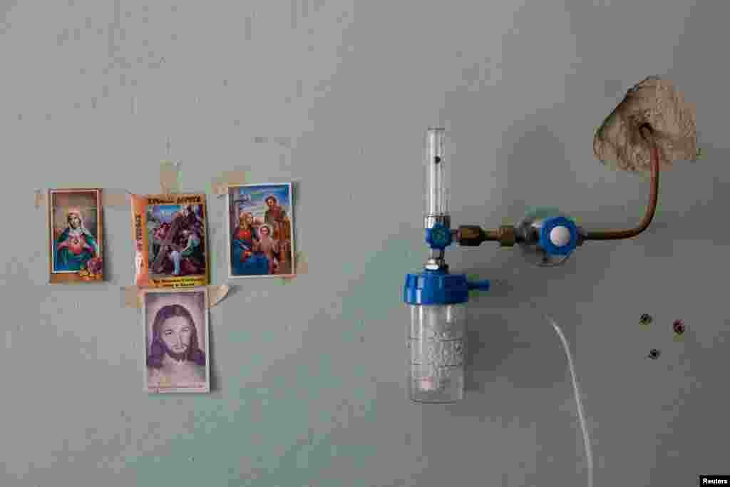 Religious images hang on the wall inside the COVID-19 ward of a hospital in Yaremche in Ivano-Frankivsk Region, Ukraine.