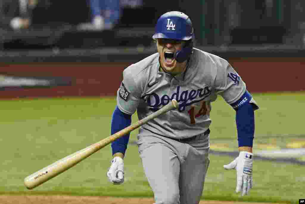 Los Angeles Dodgers' Enrique Hernandez celebrates a RBI-double against the Tampa Bay Rays during the sixth inning in Game 4 of the baseball World Series, Oct. 24, 2020, in Arlington, Texas.