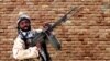 FILE - Boko Haram leader Abubakar Shekau holds a weapon at an unknown location in Nigeria in this still image taken from an undated video obtained Jan. 15, 2018. 