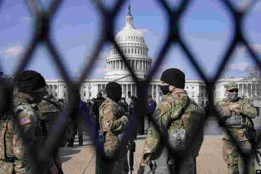 National Guard keep watch on Capitol Hill in Washington, D.C. Capitol Police say they have uncovered intelligence of a "possible plot" by a militia group to breach the U.S. Capitol.