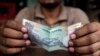 Plunging Currency, Consumption Slowdown Hamper India's Economy
