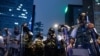 Riot police stand guard after a protest against a controversial extradition law proposal in Hong Kong on June 12, 2019.