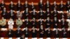 Delegates applaud as Chinese President Xi Jinping arrives for the opening session of China's National People's Congress (NPC) at the Great Hall of the People in Beijing, Friday, May 22, 2020. (AP Photo/Ng Han Guan, Pool)