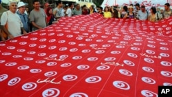 People demonstrate against Tunisia's Islamist-led government, Constituent Assembly headquarters in Tunis, Sept. 7, 2013.
