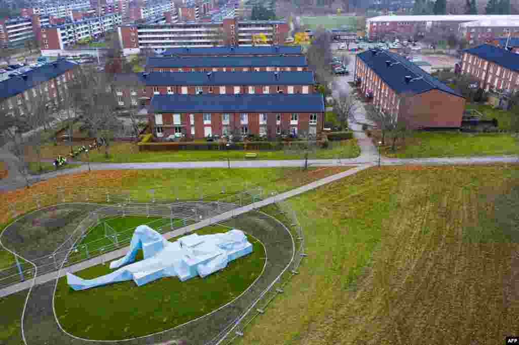 This aerial view photo shows one of two "Varbergs Giants", a giant sculpture by French artist Xavier Veilhan displayed in Varberg, south of Stockholm, Sweden.