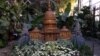 The U.S. Capitol building, created completely from plant materials, is a focal point of the annual holiday display at the U.S. Botanic Garden.