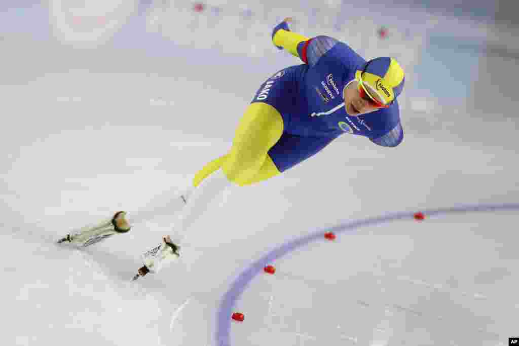 Sweden's Nils van der Poel competes during men's 5,000 meters race at the World Championships Speedskating Single Distance at the Thialf ice arena in Heerenveen, northern Netherlands.