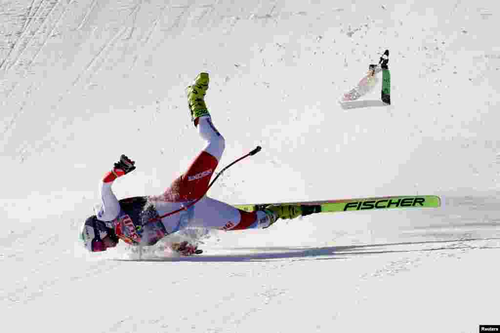 Switzerland's Urs Kryenbuehl crashes at the finish line during an alpine ski, men's World Cup downhill in Kitzbühel, Austria.