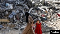 Aftermath of Israeli strikes at the area where Israeli hostages were rescued on Saturday, in Nuseirat refugee camp