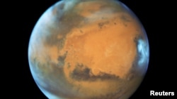 FILE - The planet Mars is shown May 12, 2016 in this NASA Hubble Space Telescope view when it was 50 million miles from Earth.