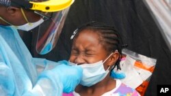 Dorah Cerisene, 9, gets tested for COVID-19, in North Miami, Fla., Aug. 31, 2021.